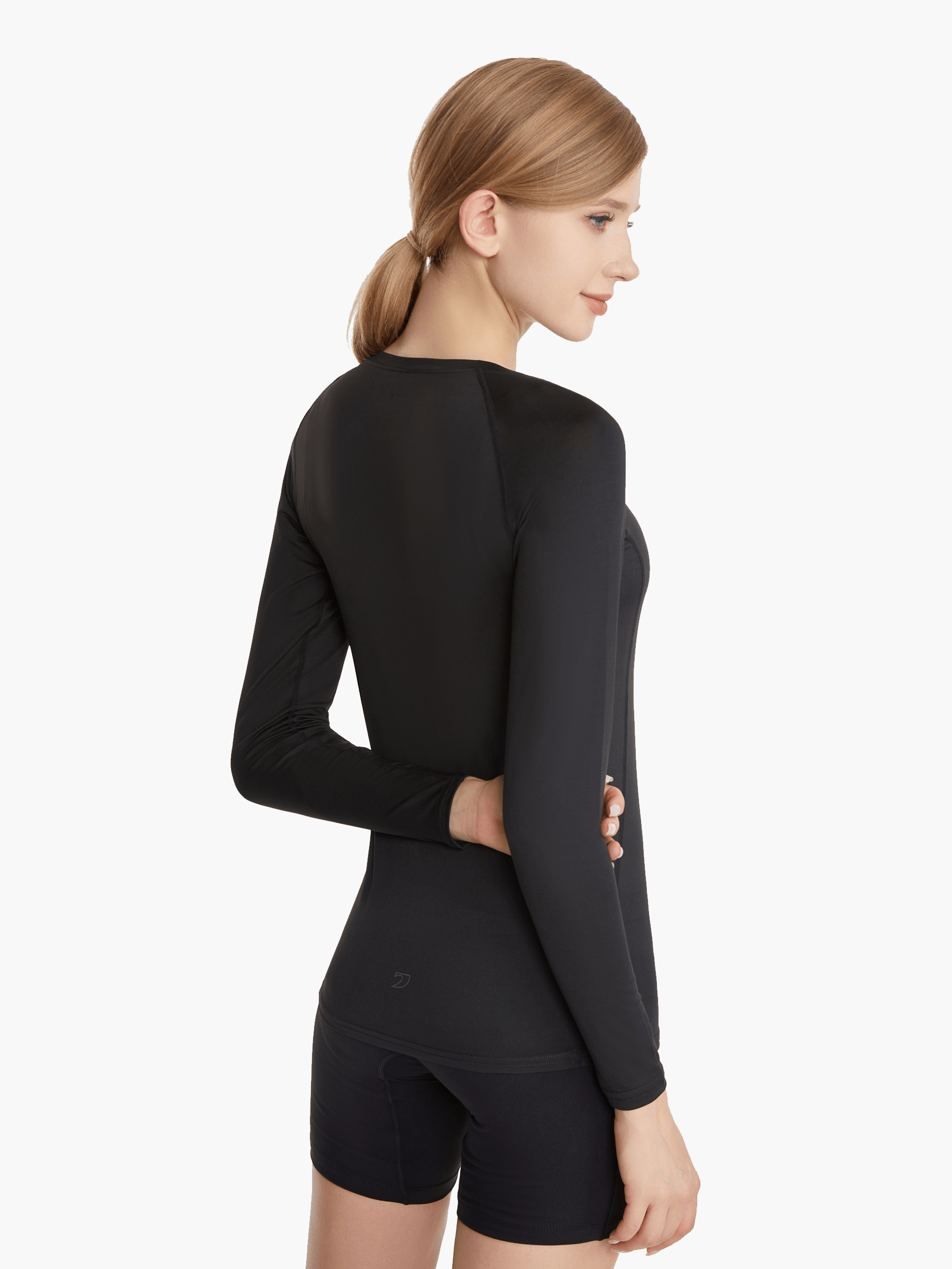 Angled front view of the SolarShield UVTee Long Sleeve for Ladies in black, showcasing its feather-light fabric, long sleeves for enhanced sun protection, and tailored fit for female rowers.