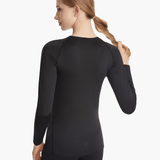 Angled back view of the SolarShield UVTee Long Sleeve for Ladies in black, emphasizing seamless construction and advanced UV-blocking technology for performance on and off the water.