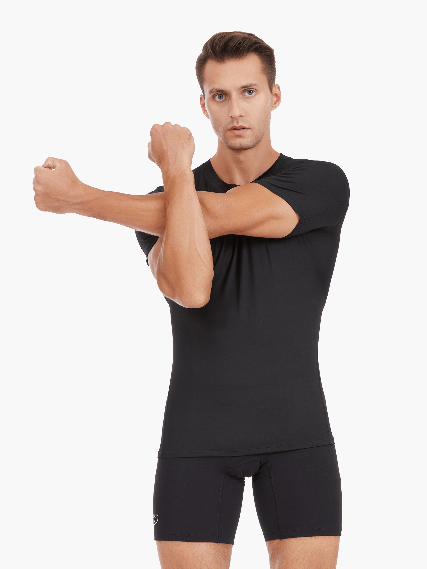 Front view of the Men’s UVTee Lightweight Baselayer in black, with the model stretching, highlighting the moisture-wicking fabric, flatlock stitching, and athletic fit designed for rowers.