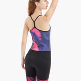 Back view of the Velocity Women’s Zootie with sleek black bottom, over-the-shoulder straps, and vibrant abstract design on the upper body