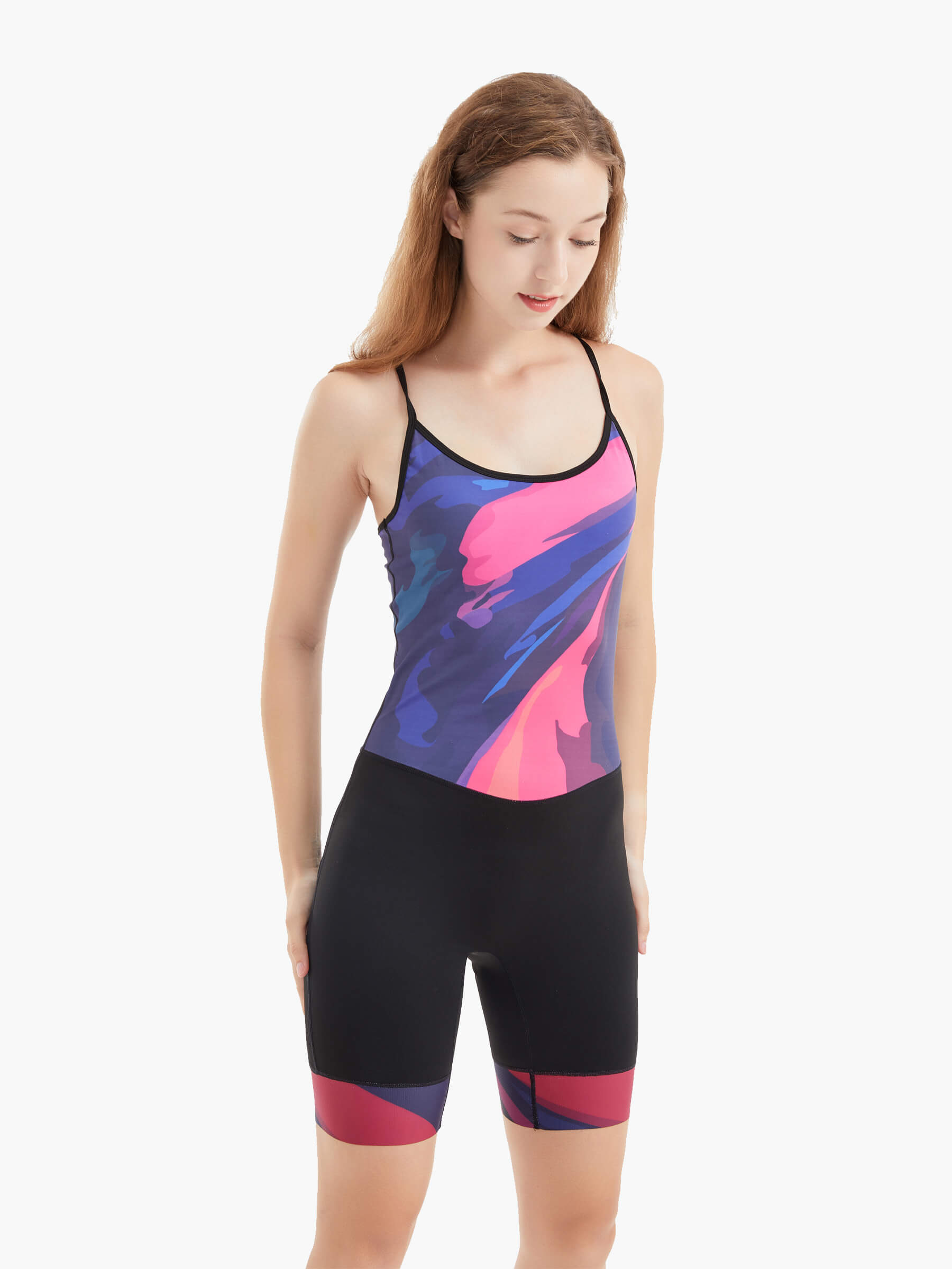Side view of the Velocity Women’s Rowing Suit, emphasizing its seamless construction, ergonomic fit, and abstract design in shades of pink and blue for rowers.