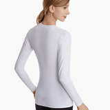 Angled back view of the SolarShield UVTee Long Sleeve for Ladies in white, emphasizing seamless construction and advanced UV-blocking fabric for performance on the water.