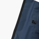 Close-up of the top zipper section of the backpack with a secure flap closure.