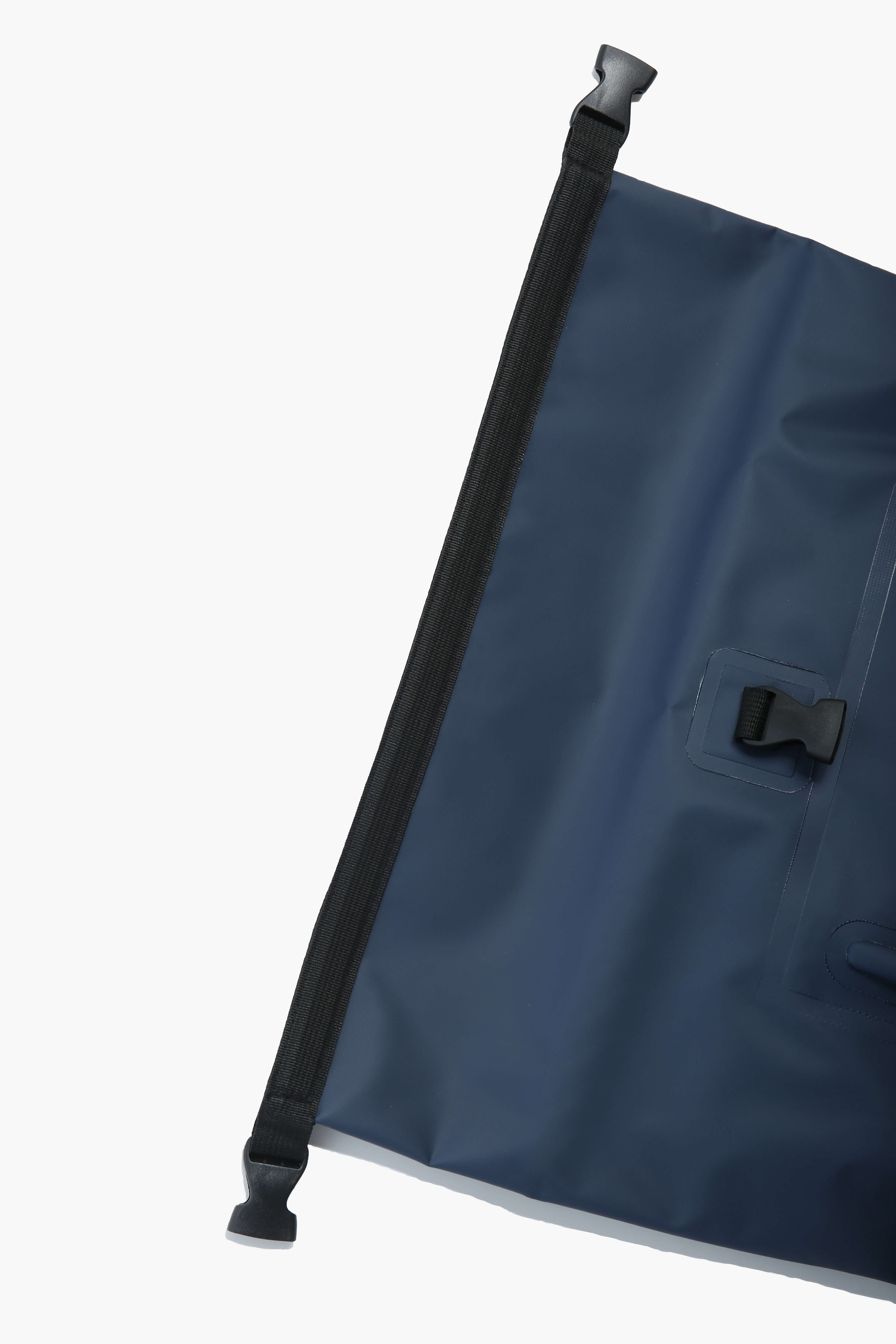 Close-up of the top zipper section of the backpack with a secure flap closure.