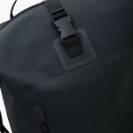 Close-up view of the backpack's secure locking mechanism on the top flap.