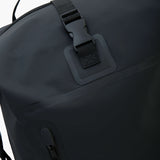 Close-up view of the backpack's secure locking mechanism on the top flap.