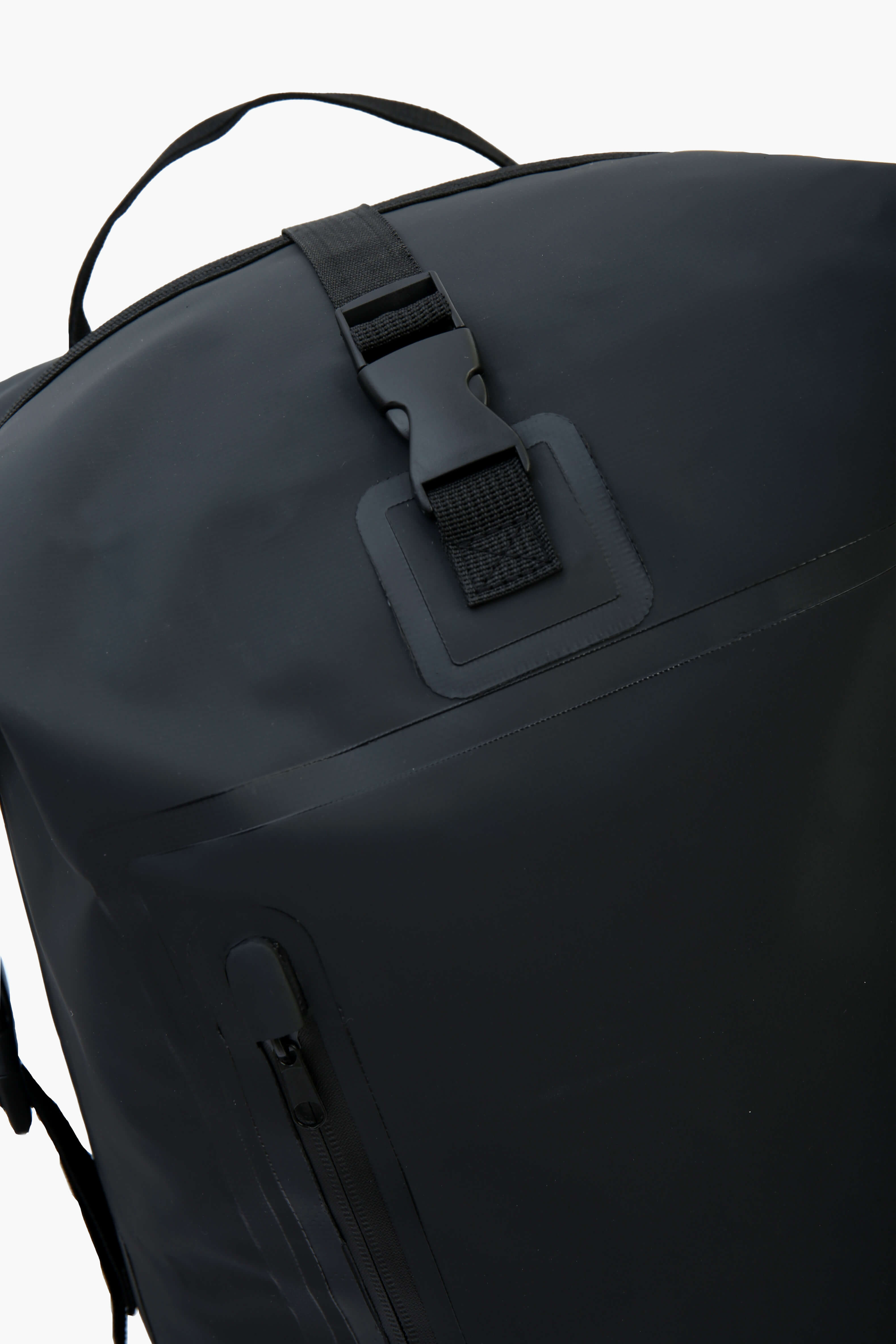 Close-up view of the backpack's secure locking mechanism on the top flap.