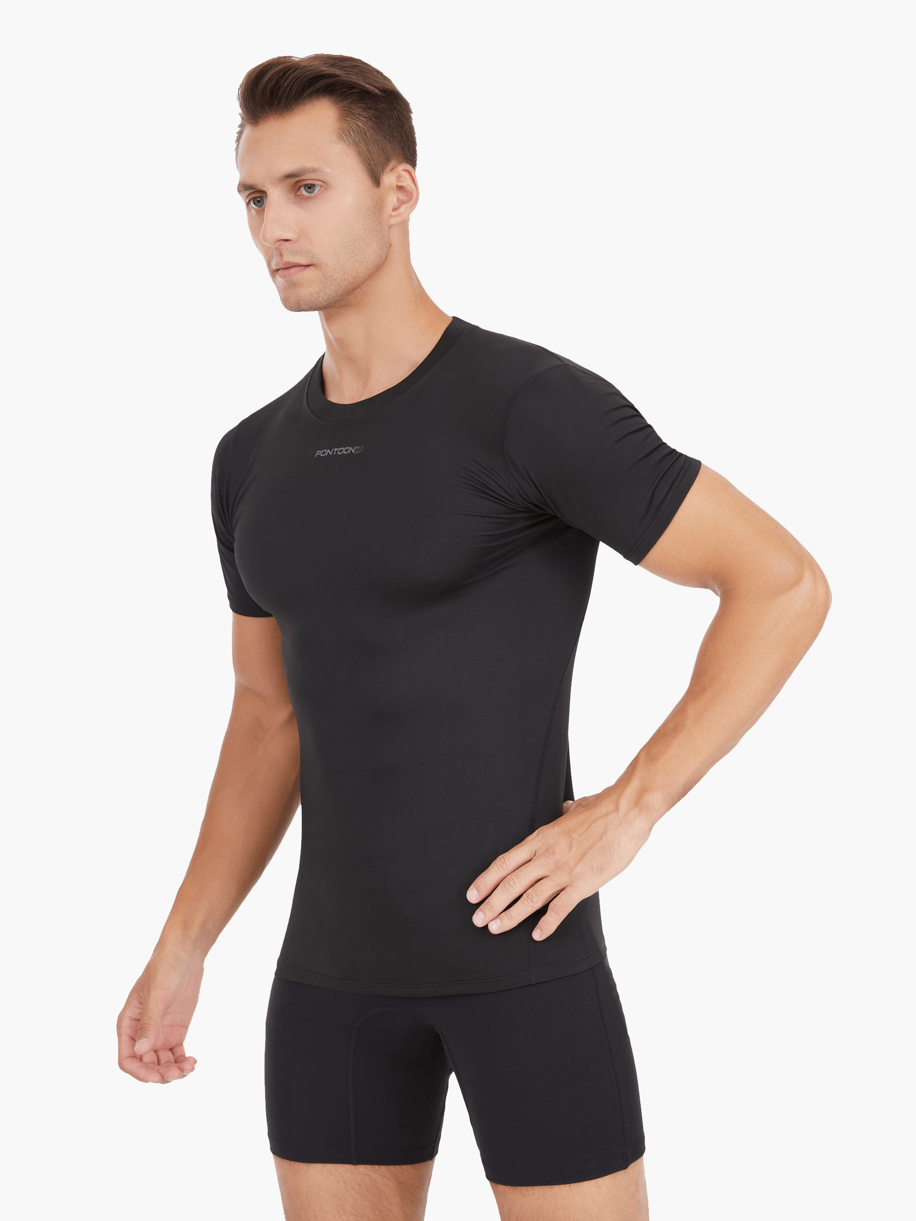 Side view of the Men’s UVTee Lightweight Baselayer in black, showcasing its form-fitting design, breathable fabric, and ergonomic fit for unrestricted movement during rowing.