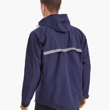 Back view of the SprayShield Pro Rowing Jacket in navy, showcasing the high-visibility reflective strip on the back flap for enhanced safety during rowing in low-light conditions.