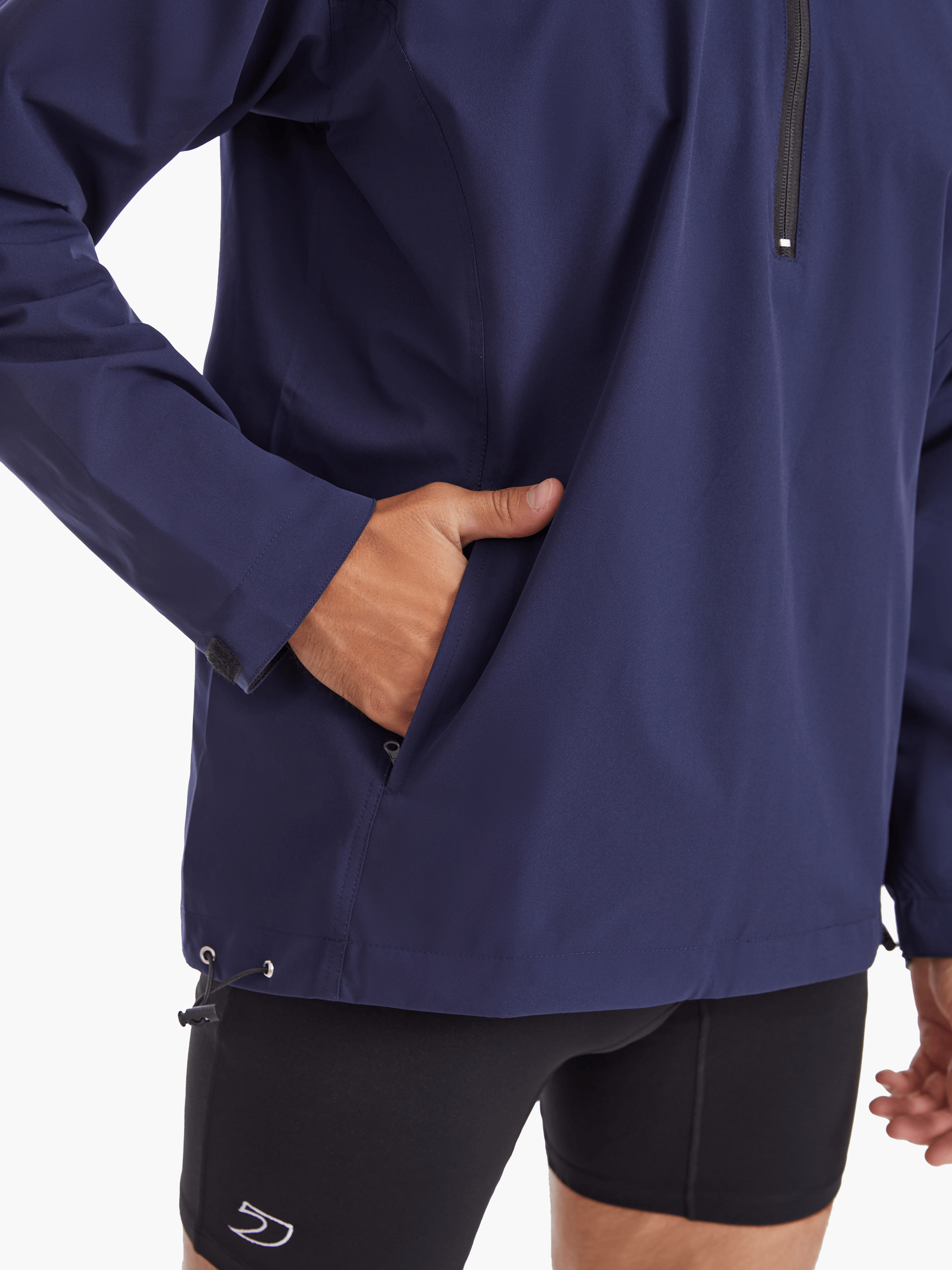 Side view of the SprayShield Pro Rowing Jacket in navy, highlighting the practical side pockets for secure storage of essentials during rowing sessions.