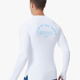 Paul wearing a white long-sleeve UV Tee with head of the yarra 2025 text on the back.