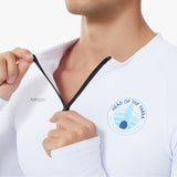 Paul wearing a white Long Sleeve UV Tee Baselayer with head of the yarra 2025 logo on the chest